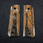Two 1911 laser engraved gun grips with intricate crusader designs on a dark background