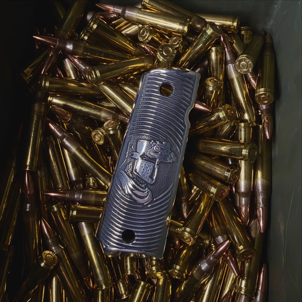 Custom 1911 laser engraved aluminum grips with a crusader design in a ammo box