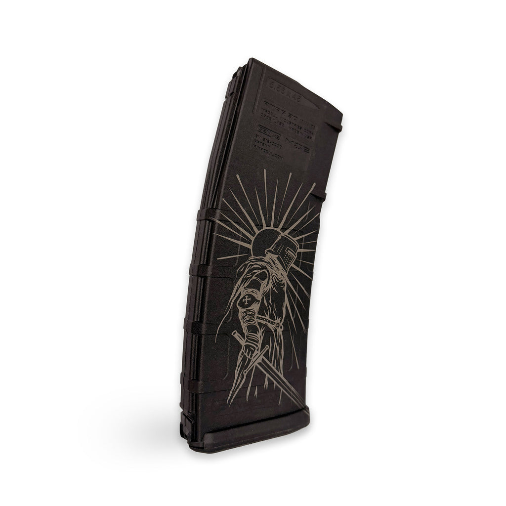 Black rifle magazine with engraved design on a white background