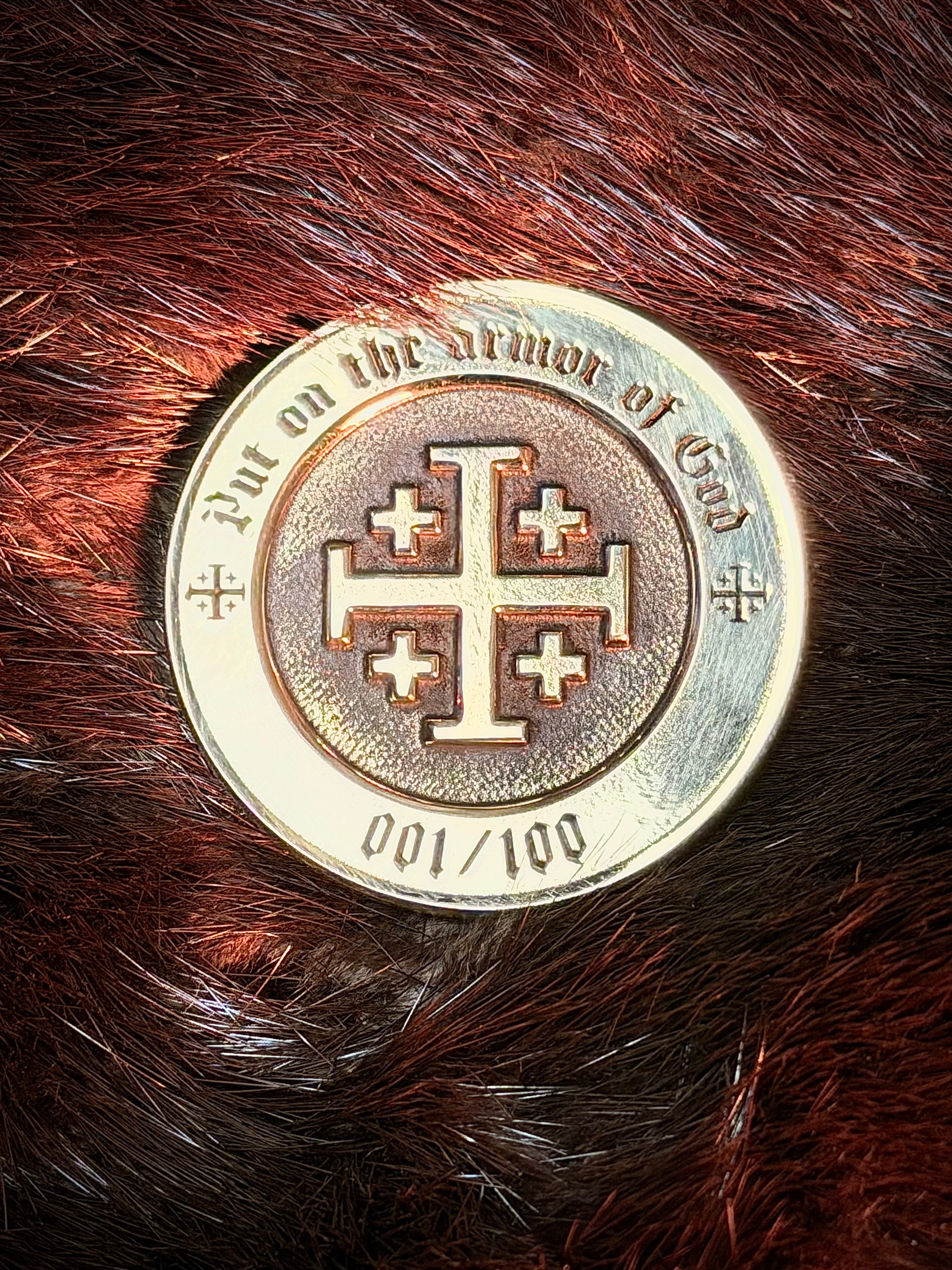 Limited edition Founders Club coin with Armor of God Jerusalem cross on a fur background. 