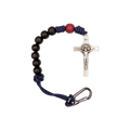 Bracelet with black beads, red accent bead, and silver crucifix on a white background