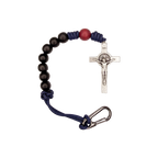 Bracelet with black beads, red accent bead, and silver crucifix on a white background