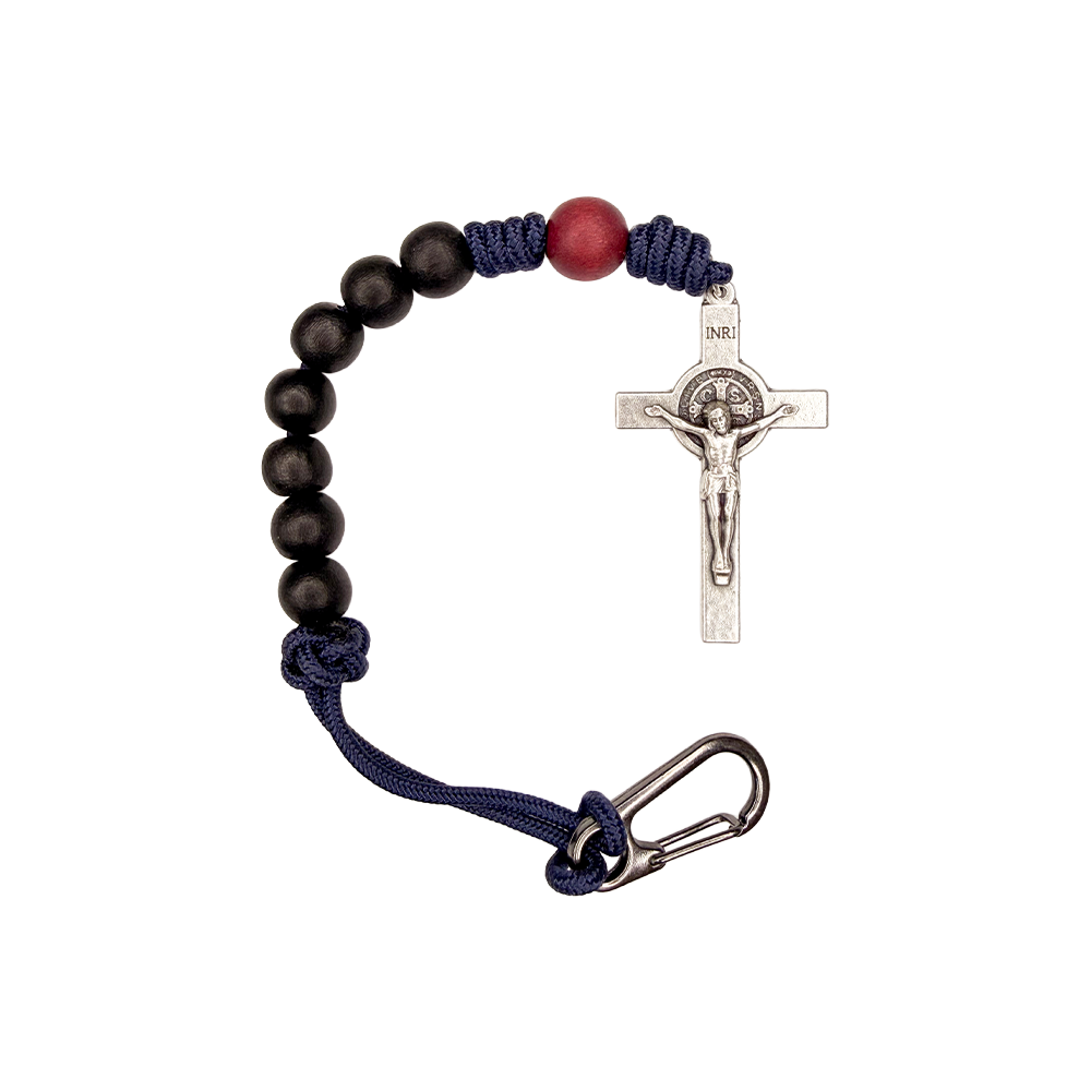 Bracelet with black beads, red accent bead, and silver crucifix on a white background