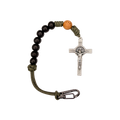 Bracelet with black beads, a silver crucifix, and a carabiner on a white background