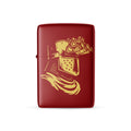 Red lighter with gold graphic design on a white background