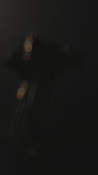 Custom 1911 aluminum gun grips with engraved crusader designs on a textured surface.